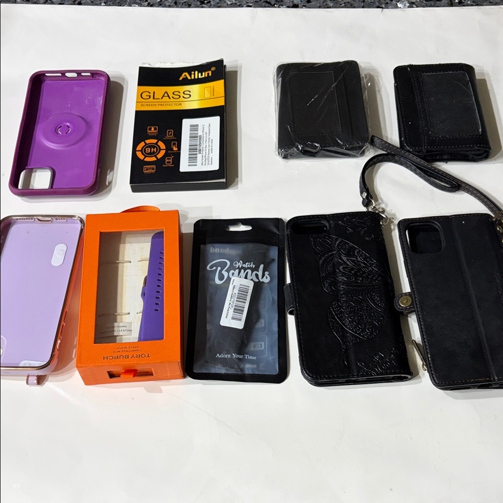 Four Phone case, two Apple Watch bands, two security wallets, 1 screen protector